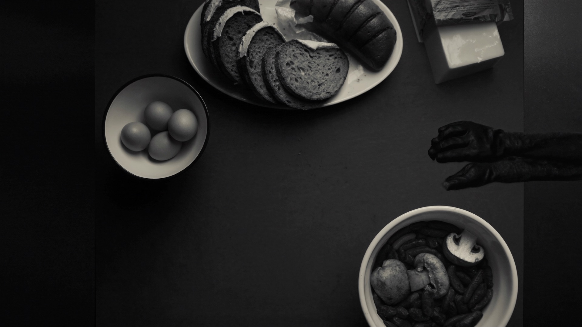 Fresh healthy ingredients and bowls on a dark surface.