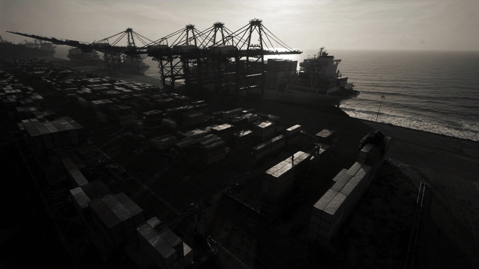 Global shipping container port at dusk, representing FreightGate's supply chain software.